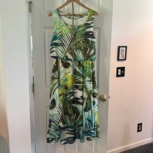 Sleeveless dress with bottom hem longer in back